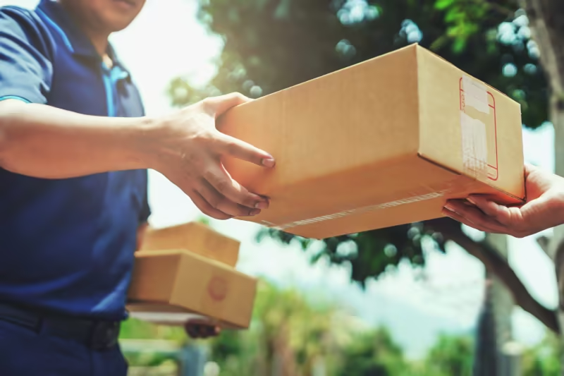 A parcel being handed over at delivery